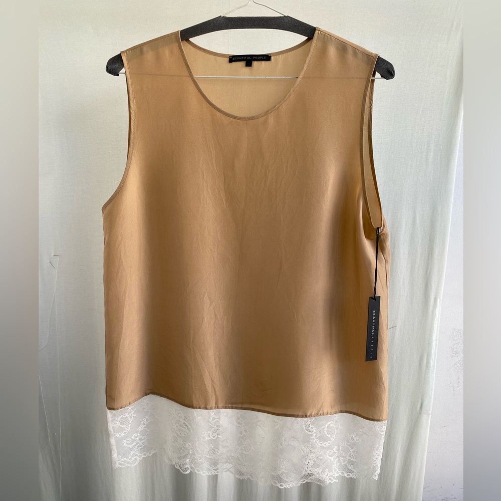 Tan color natural silk top with a white lace detail at the bottoms.